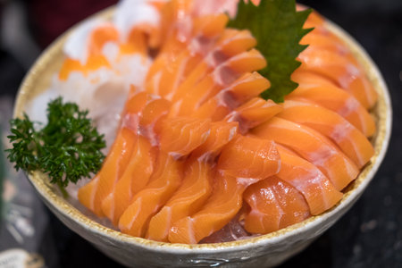 Sashimi salmon sets on a big bowl placed on ice. Fresh quality Japanese food