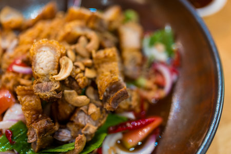 Fried pieces of pork for crispy skin topping on Thai saladの写真素材