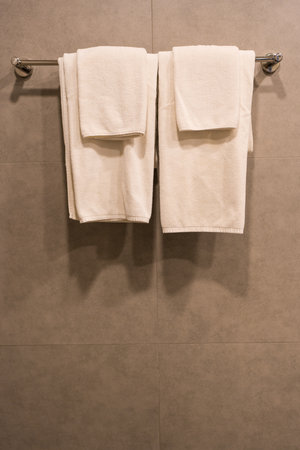 Minimalist silver metallic towel rack hanging fixture. Clean Simple and Elegant Bathroom Accessory Designの写真素材