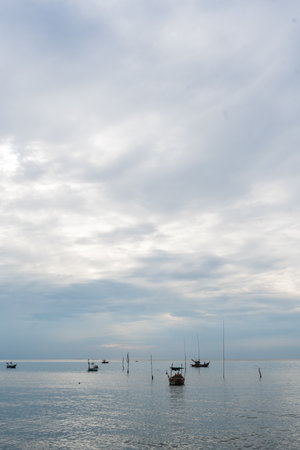A small fishing boat anchored near Bang Saen Beach in the Gulf of Thailand. Bangsaen Beach, Chon Buri, Thailandの写真素材