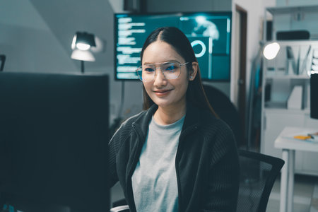 Lovely young lady typing keyboard coding developer comfortable programmer, startup office room interiorの写真素材