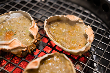 Japanese food, Kani Miso, crab miso grill on the stove in the restaurant. Selective focusの写真素材