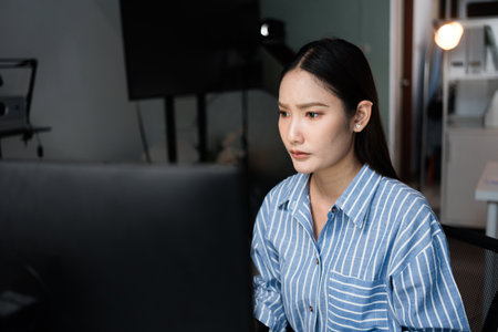 Portrait of tired sad business Asian woman at work. Depression, or employee life stress conceptの写真素材