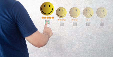 Hand touching to virtual screen with happy face and five stars for excellent evaluation after customer use product and service concept. Positive review, excellent product, happy and satisfied user. Evaluation opinionの写真素材