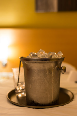 Ice bucket on a white bed in a luxury hotelの写真素材