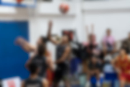 A blurred background of basketball player in stadium