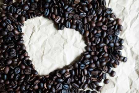 Coffee beans frame border with heart shaped. Close upの写真素材