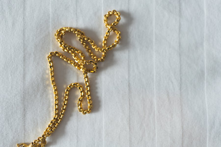 Elegant gold chain necklace, luxurious accessory. Top viewの写真素材