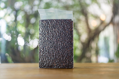 Organic brown rice in vacuum packaging. Riceberry rice is dark purple rice similar to ripe berries, rich in nutrients and has good antioxidant properties.の写真素材