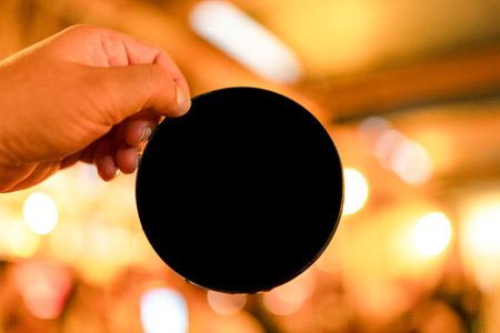 A hand holding a blank blank mock up banner roundの写真素材