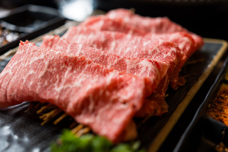 A piece of raw beef for yakiniku or shabu at a Japanese. Close up