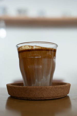 Close up photo of coffee on wooden table