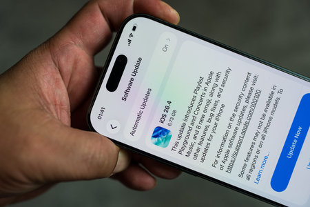 Bangkok, Thailand - March 27, 2026 : Apple iPhone 17 its screen with iOS 26.4 software update...