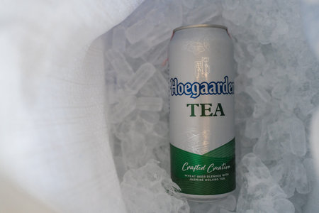 Bangkok, Thailand - March 31, 2026 : Hoegaarden TEA, Jasmine Oolong Tea, 500ml cans placed on ice....