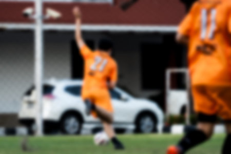 Blurred background of soccer players playing a soccer match on soccer