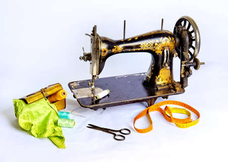 Old, historical sewing machine, sissers and equipmentの写真素材