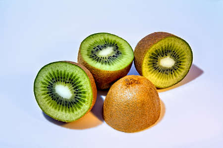 Kiwis sliced on white backgroundの写真素材