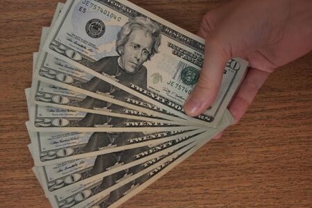 Hand with dollars