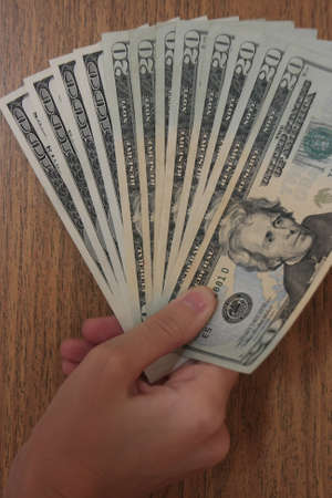 Hand with dollarsの写真素材