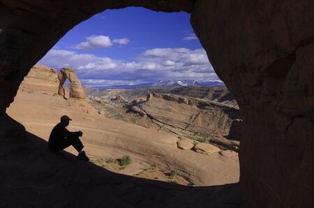 Delicate Arch seeing through Frame  Arch, Arches National Park, Utah, USAの写真素材