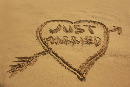 Just married written in sand on a beachの写真素材
