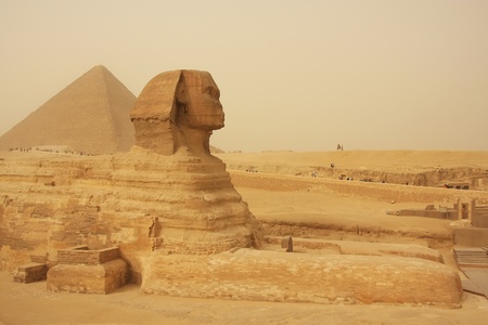 The Sphinx and Great Pyramid of Khufu in a sand storm, Cairo, Egyptの写真素材
