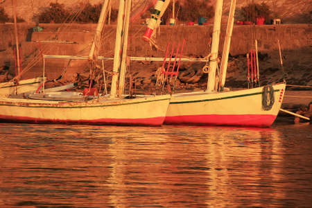 Felucca boats at the harbor at sunset, Luxor, Egyptの写真素材
