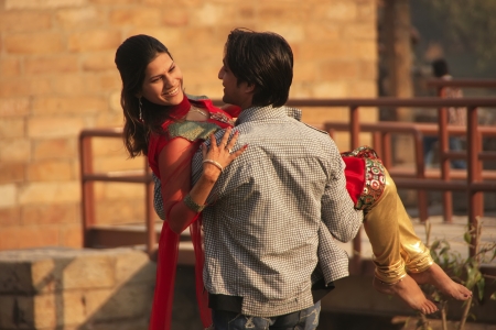 Indian man carrying indian woman at Qutub Minar complex, Delhi, Indiaのeditorial素材