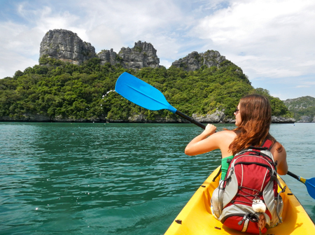 Young woman kayaking in Ang Thong National Marine Park, Thailandの写真素材
