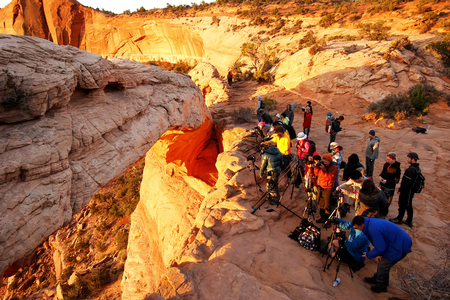Photographers and tourists watching sunrise at  Mesa Arch, Canyonlands National Park, Utahのeditorial素材