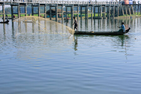 Local man fishing with a net, Amarapura, Mandalay region, Myanmarのeditorial素材