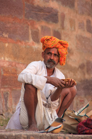 Indian man sitting at Ranthambore Fort, Rajasthan, Indiaのeditorial素材