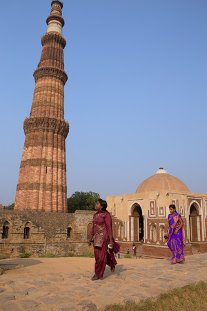 Young indian women walking near Alai gate, Qutub Minar complex, Delhi, Indiaのeditorial素材