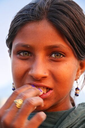 Portrait of a young girl eating, Jaipur, Indiaのeditorial素材