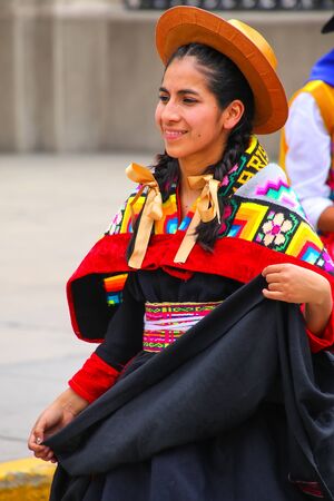 Young local woman performing suring Festival of the Virgin de la Candelaria in Lima, Peru. The core of the festival is dancing and music performed by different dance schools.のeditorial素材