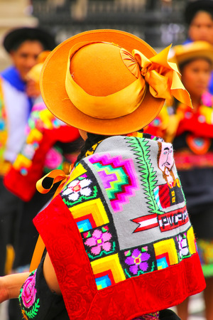 Woman wearing traditional hat and back cloth during Festival of the Virgin de la Candelaria in Lima, Peru. The core of the festival is dancing and music performed by different dance schools.のeditorial素材