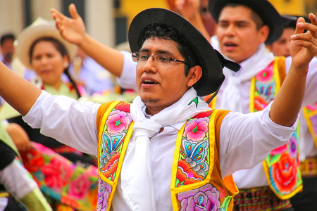 Local man dancing during Festival of the Virgin de la Candelaria in Lima, Peru. The core of the festival is dancing and music performed by different dance schools.のeditorial素材