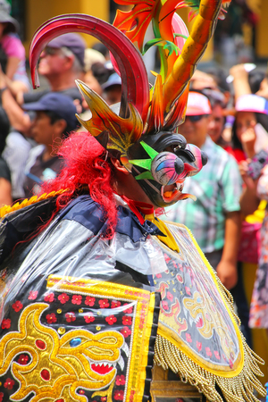 Local man dancing during Festival of the Virgin de la Candelaria in Lima, Peru. The core of the festival is dancing and music performed by different dance schools.のeditorial素材