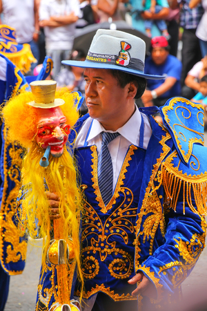 Local man dancing during Festival of the Virgin de la Candelaria in Lima, Peru. The core of the festival is dancing and music performed by different dance schools.のeditorial素材
