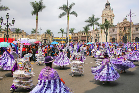 Local people dancing during Festival of the Virgin de la Candelaria in Lima, Peru. The core of the festival is dancing and music performed by different dance schools.のeditorial素材