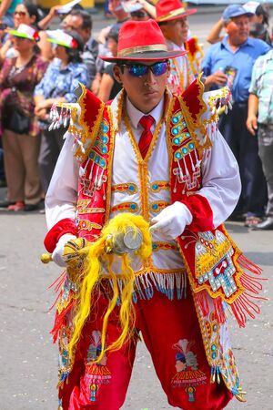 Local man dancing during Festival of the Virgin de la Candelaria in Lima, Peru. The core of the...