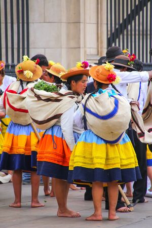 Local women standing during Festival of the Virgin de la Candelaria in Lima, Peru. The core of the festival is dancing and music performed by different dance schools.のeditorial素材