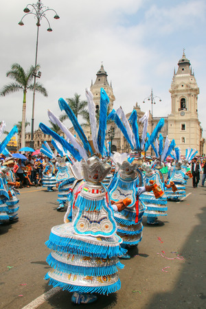 Local men dancing during Festival of the Virgin de la Candelaria in Lima, Peru. The core of the festival is dancing and music performed by different dance schools.のeditorial素材