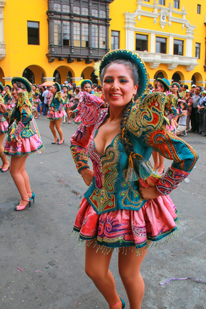 Young local woman dancing during Festival of the Virgin de la Candelaria in Lima, Peru. The core of the festival is dancing and music performed by different dance schools.のeditorial素材
