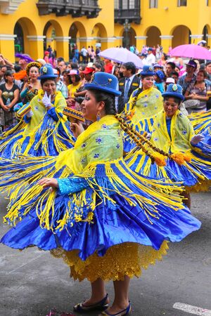 Local women dancing during Festival of the Virgin de la Candelaria in Lima, Peru. The core of the festival is dancing and music performed by different dance schools.のeditorial素材