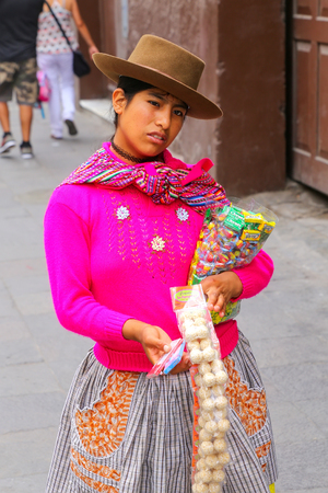 Local woman selling snacks in the street of Lima, Peru. Lima is the capital and the largest city of Peru.のeditorial素材