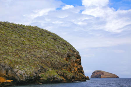 Small islands off the shore of Santiago island in Galapagos National Park, Ecuador.の写真素材
