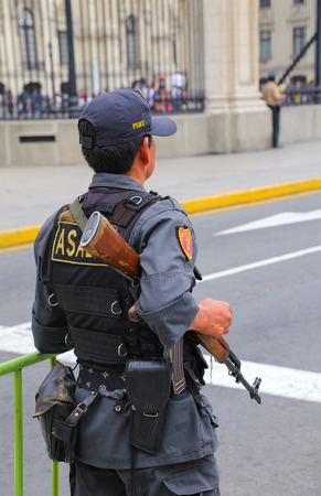 Policman standing near Government Palace in Lima, Peru. Peruvian National Police is one of the largest police forces in South America.のeditorial素材