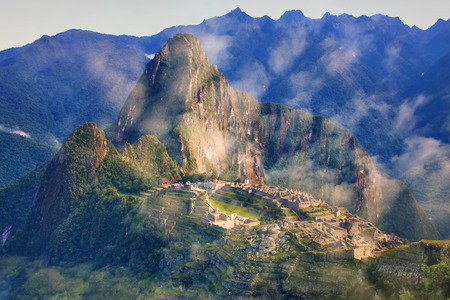 Inca citadel Machu Picchu with morning fog, Peru. In 2007 Machu Picchu was voted one of the New Seven Wonders of the World.の写真素材