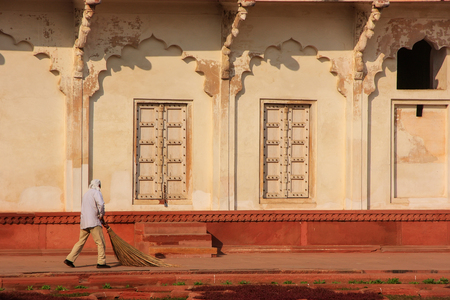Worker sweeping in Anguri Bagh (Grape Garden) in Agra Fort, Uttar Pradesh, India. The fort was built primarily as a military structure, but was later upgraded to a palace.のeditorial素材